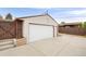 Spacious garage with a white door providing secure parking and storage options at 3176 Depew St, Wheat Ridge, CO 80214