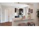 Kitchen bar features granite countertops, pendant lighting, and seamless transition to the rest of the home at 3176 Depew St, Wheat Ridge, CO 80214