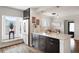 Bright kitchen featuring dark cabinetry, granite countertops, stainless steel appliances, and window seating at 3176 Depew St, Wheat Ridge, CO 80214