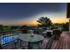 Spacious back deck features ample seating, a dining table and a fire pit, perfect for outdoor entertaining at 25779 E Jamison Cir, Aurora, CO 80016