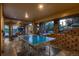 Spacious covered patio provides a ping pong table and an outdoor eating area with views of the lush grounds at 25779 E Jamison Cir, Aurora, CO 80016