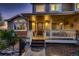 Inviting front porch with decorative door, white railings, and steps leading to a well-lit entrance at 25779 E Jamison Cir, Aurora, CO 80016
