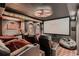 Home theater with reclining seats, a large screen, movie posters, and a snack bar at 25779 E Jamison Cir, Aurora, CO 80016
