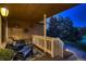 Cozy covered porch featuring comfortable seating, decorative rug, and scenic outdoor view at 25779 E Jamison Cir, Aurora, CO 80016