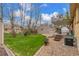 Backyard with patio, garage, and well-maintained lawn at 6905 Nelson St, Arvada, CO 80004