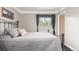 Serene bedroom showcasing a plush bed, window, and calming decor at 6905 Nelson St, Arvada, CO 80004