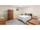 Bedroom with carpet, closet, and queen size bed at 6905 Nelson St, Arvada, CO 80004