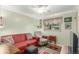Charming living room with hardwood floors and cozy seating arrangements at 6905 Nelson St, Arvada, CO 80004