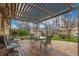 Covered patio with a table and chairs perfect for outdoor dining at 6905 Nelson St, Arvada, CO 80004
