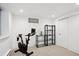 Finished basement with exercise equipment and shelving at 625 S Monroe Way, Denver, CO 80209