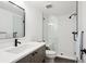 Basement bathroom with shower and modern vanity at 625 S Monroe Way, Denver, CO 80209