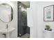 Small bathroom with shower and pedestal sink at 625 S Monroe Way, Denver, CO 80209