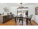 Charming dining room with a rustic table and black chairs at 625 S Monroe Way, Denver, CO 80209