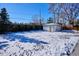 Detached garage in snowy backyard setting at 625 S Monroe Way, Denver, CO 80209