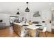 Modern kitchen with white cabinets and a large island at 625 S Monroe Way, Denver, CO 80209