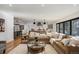 Bright and airy living room with a sectional sofa and hardwood floors at 625 S Monroe Way, Denver, CO 80209