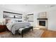 Spacious main bedroom with fireplace and large windows at 625 S Monroe Way, Denver, CO 80209