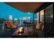 Outdoor balcony with a cozy seating area, fire pit, and breathtaking city views at 1133 14Th St # 3420, Denver, CO 80202