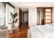 Bright bedroom with hardwood floors, seating area, and large window provides an airy feel at 1133 14Th St # 3420, Denver, CO 80202