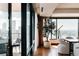 An interior dining area with elegant furniture and stunning city views at 1133 14Th St # 3420, Denver, CO 80202