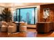 Elegant dining room with city views, a unique chandelier, and stylish decor at 1133 14Th St # 3420, Denver, CO 80202