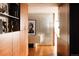 Hallway featuring wooden cabinets and floors and modern artwork, adding warmth and character at 1133 14Th St # 3420, Denver, CO 80202