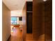 Hallway with storage closet and a glimpse of the living room with natural light and modern design at 1133 14Th St # 3420, Denver, CO 80202