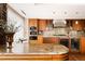 Gourmet kitchen featuring custom cabinetry, granite countertops, and a beverage cooler at 1133 14Th St # 3420, Denver, CO 80202