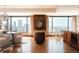 Open concept living space boasting hardwood floors, city views and elegant furnishings for a sophisticated ambiance at 1133 14Th St # 3420, Denver, CO 80202