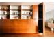 Living room featuring stylish built-in wood shelving and cabinets for storage and decor display at 1133 14Th St # 3420, Denver, CO 80202