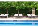 Outdoor swimming pool with lounge chairs and lush greenery, creating a relaxing oasis at 1133 14Th St # 3420, Denver, CO 80202