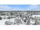 A beautiful winter aerial view of townhomes covered in snow with mountains visible in the distance at 2141 S Victor St # B, Aurora, CO 80014