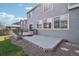 Backyard featuring a two-level deck, gravel and grass, and privacy fence at 12248 Kittredge St, Commerce City, CO 80603