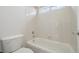 Clean white bathroom featuring a bathtub, shower, and toilet at 12248 Kittredge St, Commerce City, CO 80603