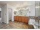 Bathroom with double vanity, soaking tub, walk-in shower, tile flooring, and lots of storage at 12248 Kittredge St, Commerce City, CO 80603