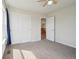 Bedroom featuring neutral walls, carpet, and a closet with double doors at 12248 Kittredge St, Commerce City, CO 80603