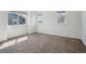 A light and airy bedroom with carpet, base trim and three windows at 12248 Kittredge St, Commerce City, CO 80603