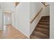 Bright entryway with hardwood floors and a staircase leading to the upper level at 12248 Kittredge St, Commerce City, CO 80603
