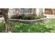 Well-maintained flower bed with a stone border adding curb appeal to the property at 12248 Kittredge St, Commerce City, CO 80603
