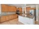 Spacious kitchen featuring stainless steel appliances, a large island, and ample cabinet space at 12248 Kittredge St, Commerce City, CO 80603
