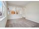 Open living room with views to the kitchen and through to other living spaces at 12248 Kittredge St, Commerce City, CO 80603