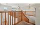 Upstairs loft with wooden railing and unique light fixtures at 12248 Kittredge St, Commerce City, CO 80603
