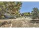 Large backyard featuring a turf area and mature trees at 14742 E Radcliff Pl, Aurora, CO 80015