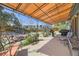 Enjoy the spacious backyard with patio cover, barbecue, and play area at 14742 E Radcliff Pl, Aurora, CO 80015