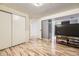 A large basement area includes vinyl flooring and access to closets and open spaces at 14742 E Radcliff Pl, Aurora, CO 80015
