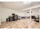 Spacious basement with wood floors and versatile layout for a home office and guest space at 14742 E Radcliff Pl, Aurora, CO 80015