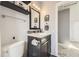 Elegant bathroom featuring a toilet, vanity with shelf, and sleek design at 14742 E Radcliff Pl, Aurora, CO 80015