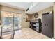 Bright dining area with sliding glass doors to the backyard and convenient cabinetry for extra storage at 14742 E Radcliff Pl, Aurora, CO 80015