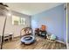 Bright playroom features hardwood floors, a window, and toys to keep the little ones entertained at 14742 E Radcliff Pl, Aurora, CO 80015