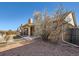 View of backyard featuring a covered patio and brick exterior at 1467 S Kenton St, Aurora, CO 80012